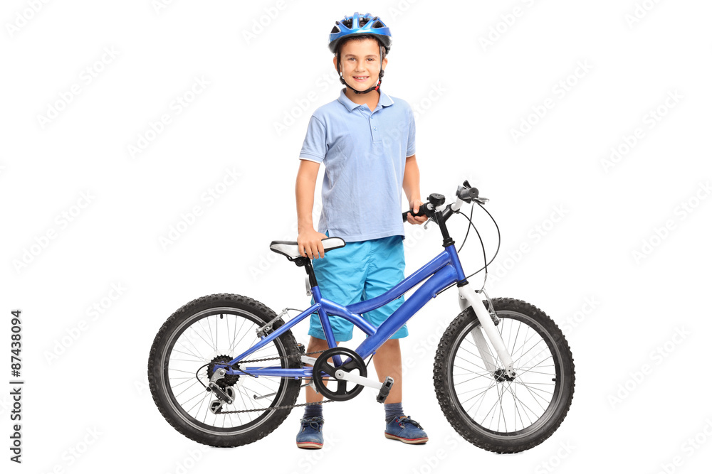 Obraz premium Little boy posing with his bicycle