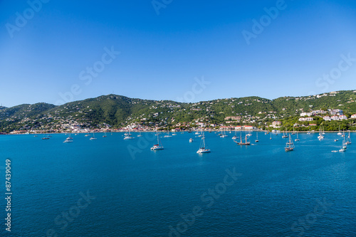 White Sailboats Moored in Blue Bay by Green St Thomas © dbvirago