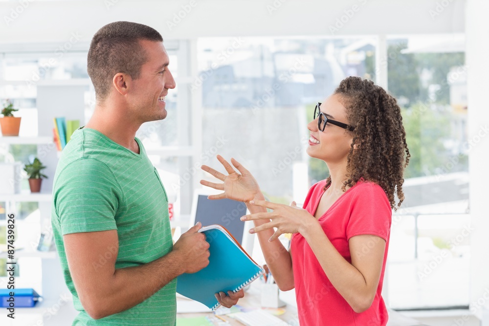 Casual business team looking at files Casual business team looking at files