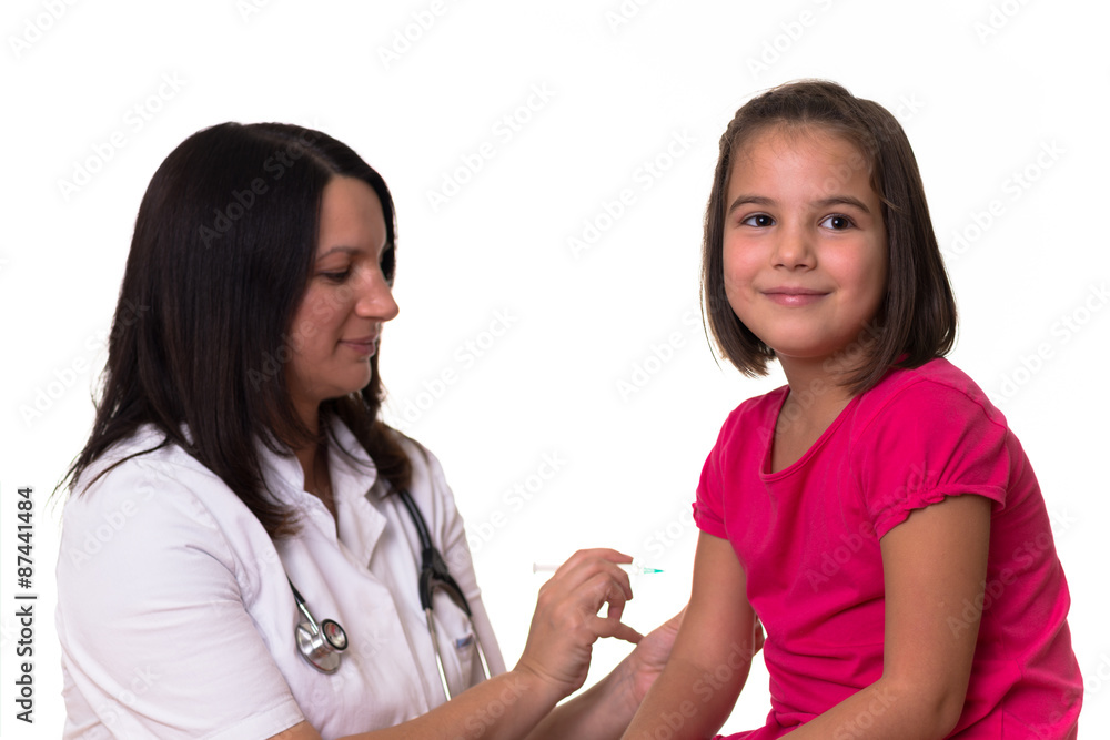 Doctor gives vaccination to a cute girl Doctor gives vaccination to a cute girl
