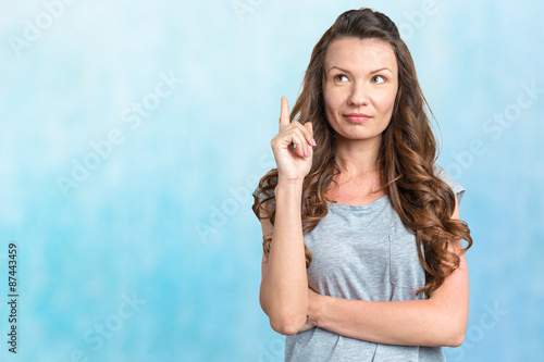 Wallpaper Mural Happy young woman on blue background Torontodigital.ca