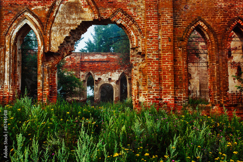 Beautiful view of old ruined red bricks church with arches