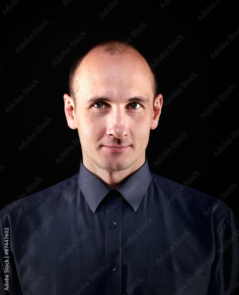 smiling middle-aged man on a black background smiling middle-aged man on a black background