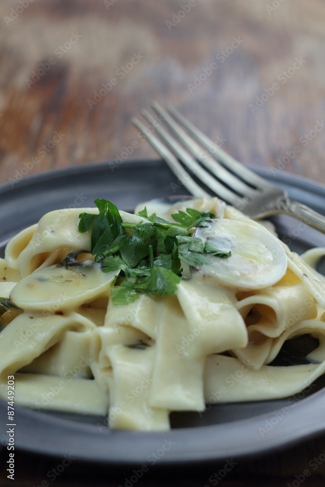 Pappardelle with white clamshells in white sauce. Pappardelle with white clamshells in white sauce.