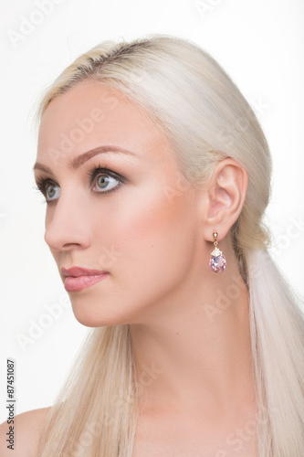 beautiful girl with long white hair and earrings. fashionable