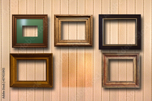 Fototapeta Naklejka Na Ścianę i Meble -  Gilded wooden frames for pictures on background