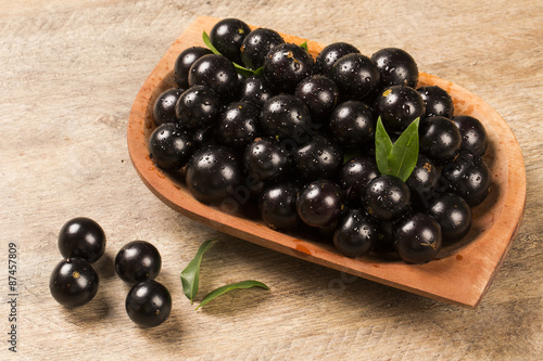 Berry Jaboticaba in bowl on wooden table