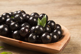 Berry Jaboticaba in bowl on wooden table