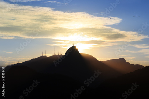 Sunset behind Mountain Corcovado Christ the Redeemer  Rio de Jan
