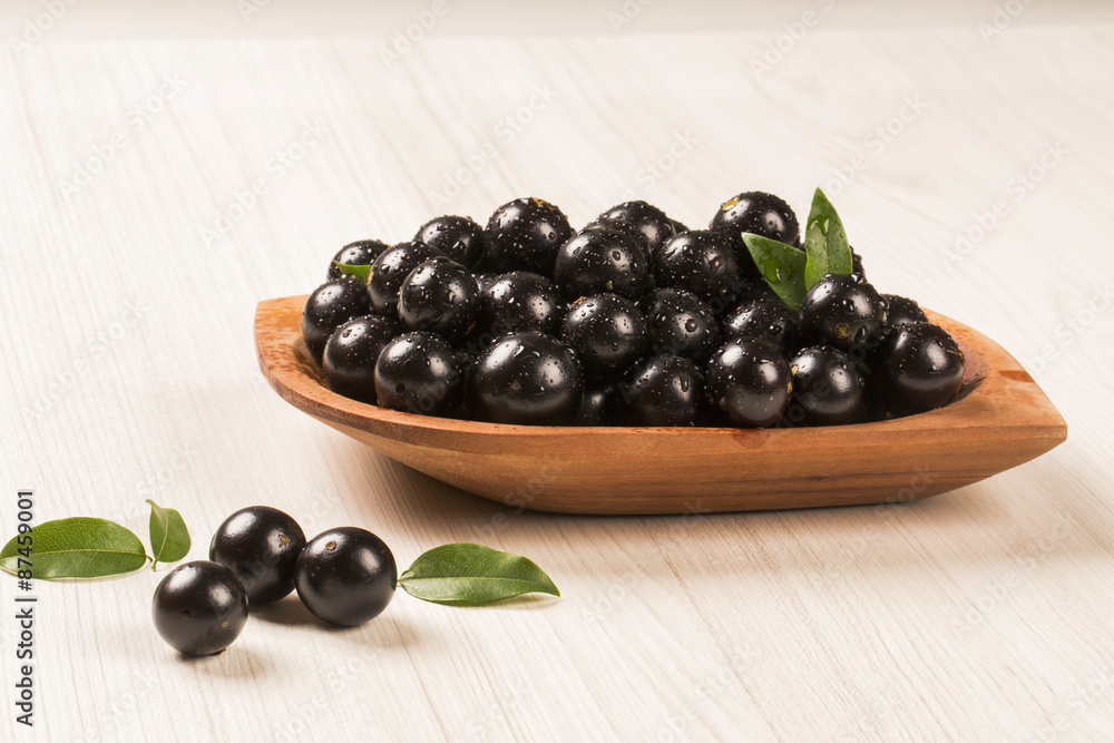 Berry Jaboticaba in bowl on white background Berry Jaboticaba in bowl on white background