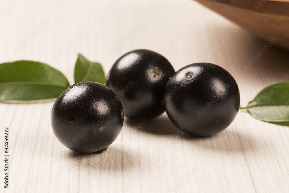 Berry Jaboticaba in bowl on white background Berry Jaboticaba in bowl on white background