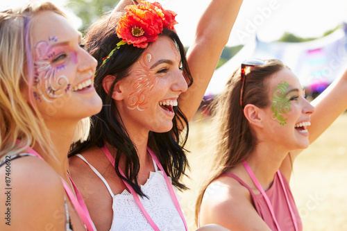 Three girl friends at a music festival photo