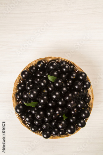 Berry Jaboticaba in bowl on white background photo