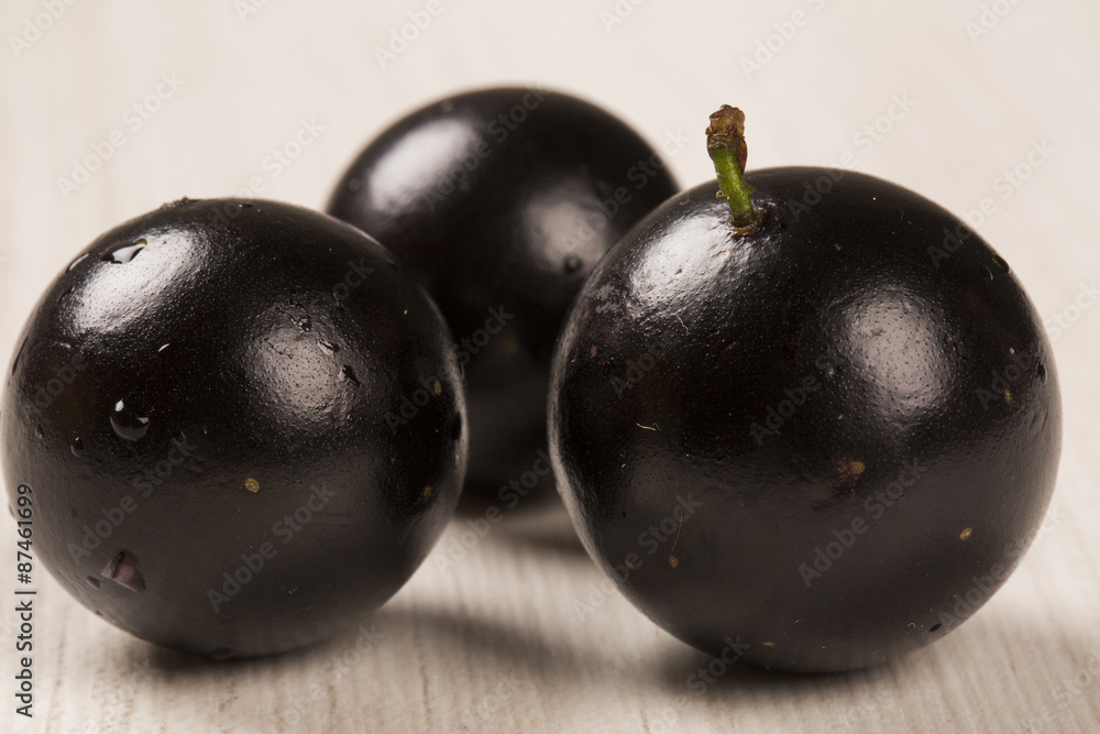 Berry Jaboticaba in bowl on white background Berry Jaboticaba in bowl on white background