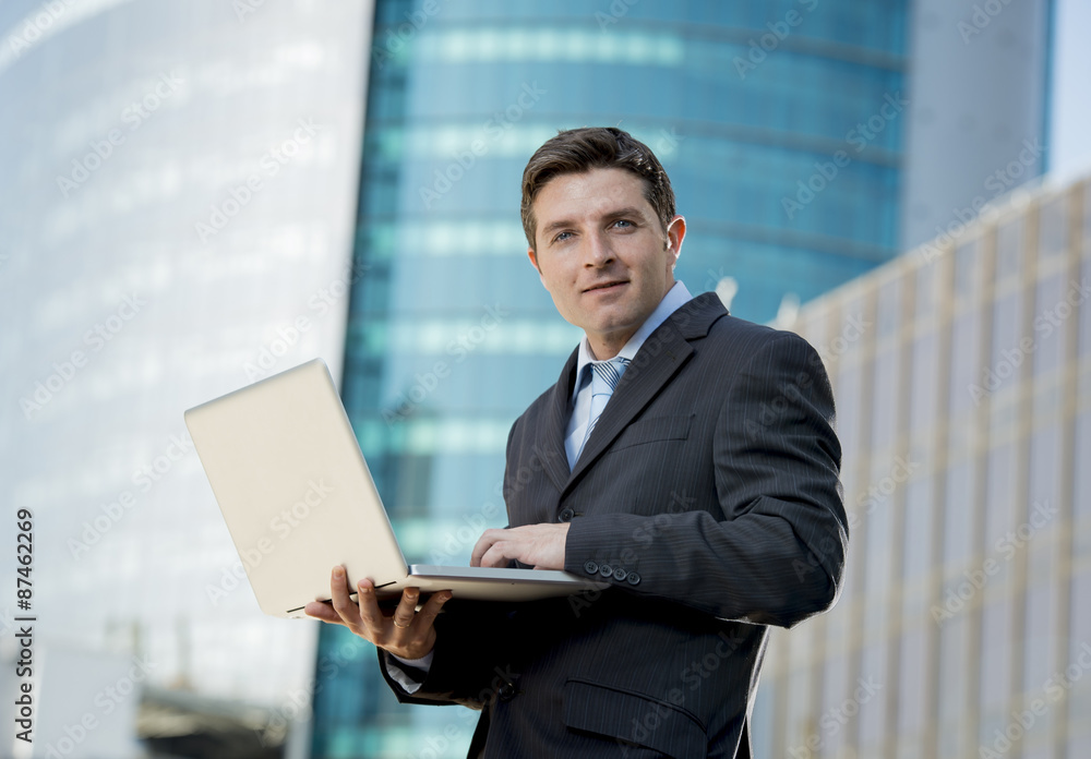 businessman holding computer laptop working outdoors businessman holding computer laptop working outdoors