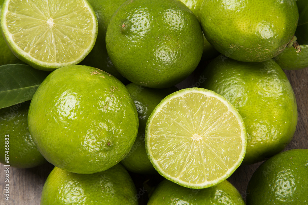 Fresh citrus lime with mint close up on wooden background Fresh citrus lime with mint close up on wooden background