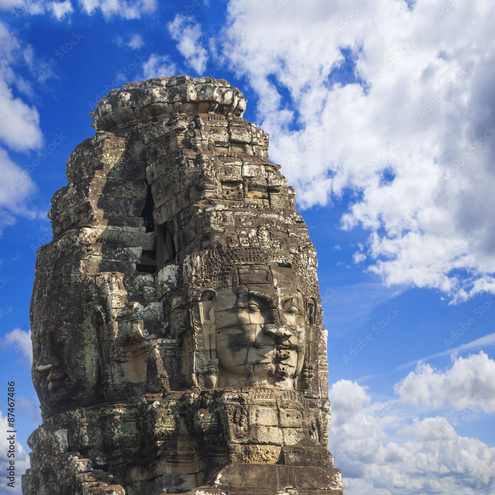 Fototapeta premium Ancient stone faces of king Jayavarman VII at The Bayon temple,