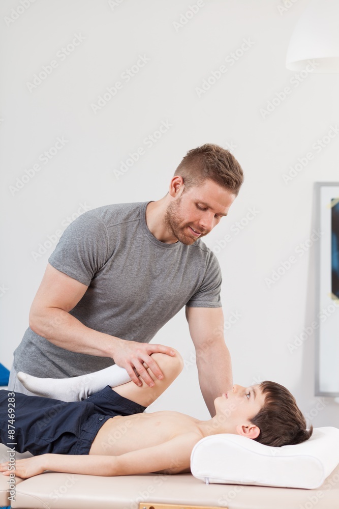 Fototapeta premium Physiotherapist working with little boy