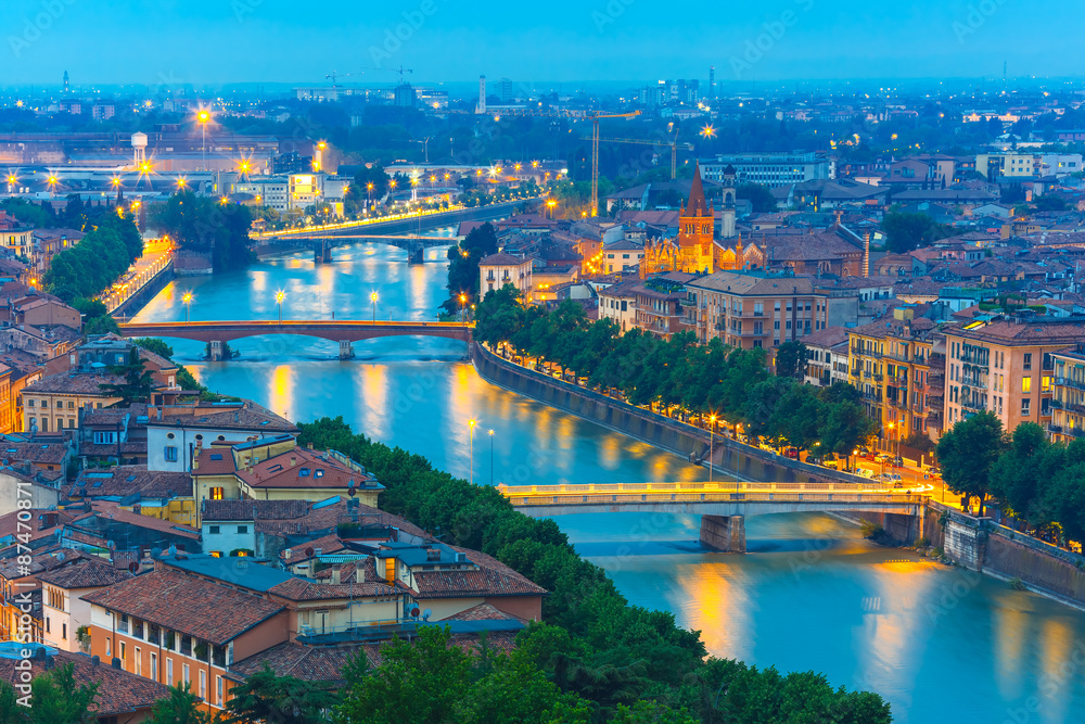 River Adige and bridges in Verona at night, Italy