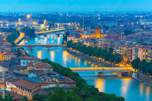 River Adige and bridges in Verona at night, Italy