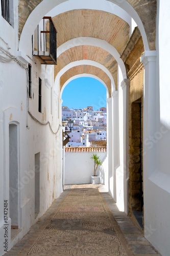 View of the skyline through the stone arches. Vejer de la Frontera one of the most beautiful white villages of Andalusia, Spain.