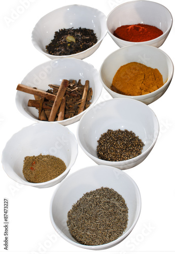 Food condiments in round dishes.