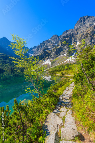 Path along beautiful green water Morskie Oko lake, Tatra Mountains, Poland