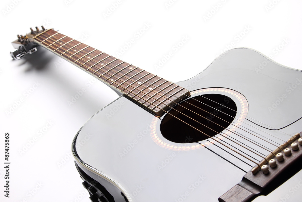 Obraz premium Black acoustic guitar on white background