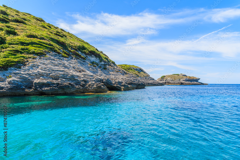 Crystal clear water in sea bay near Bonifacio town, Corsica island, France