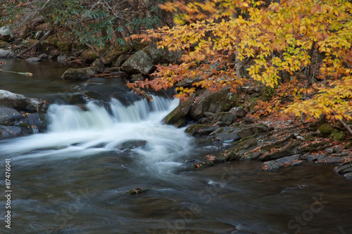 Fototapeta Naklejka Na Ścianę i Meble -  Mountain stream over rocks in the fall