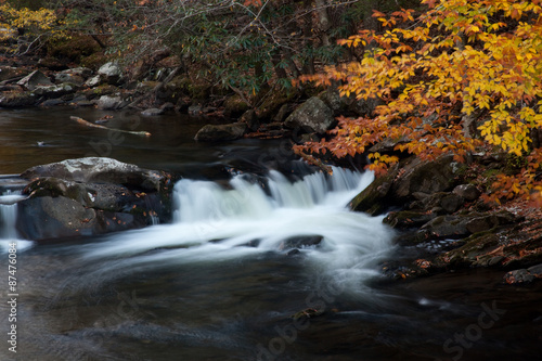 Mountain stream over rocks in the fall