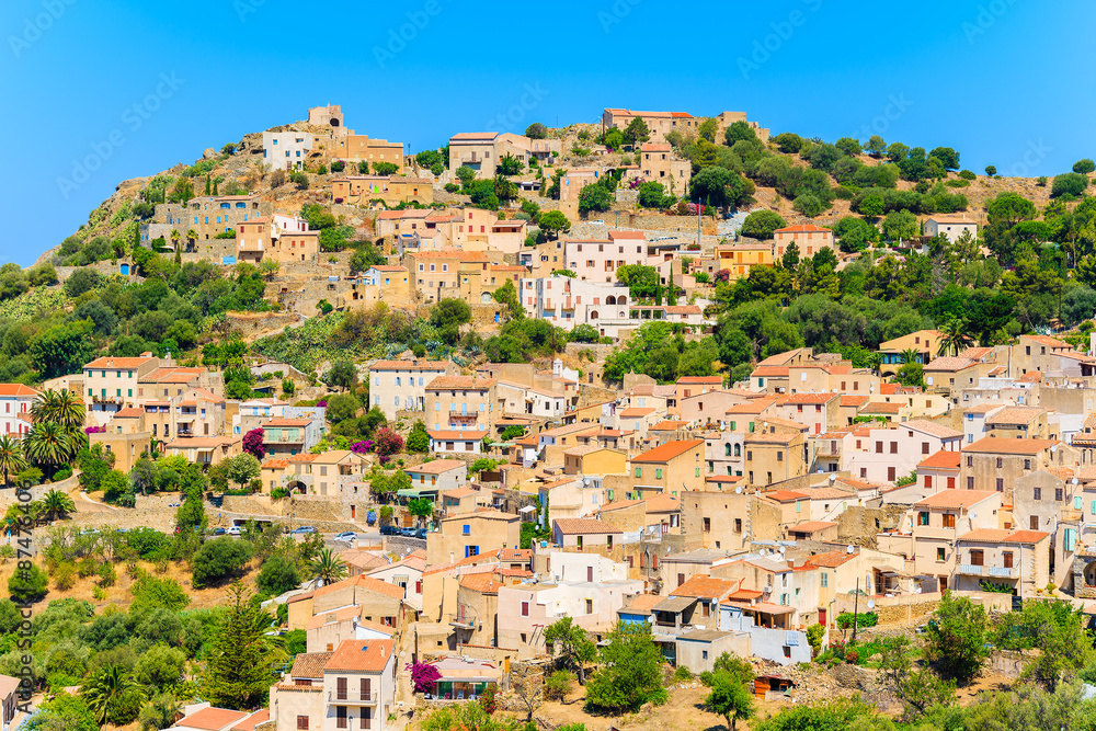Fototapeta premium View of Corbara village with stone houses built in traditional Corsican style on top of a hill, France
