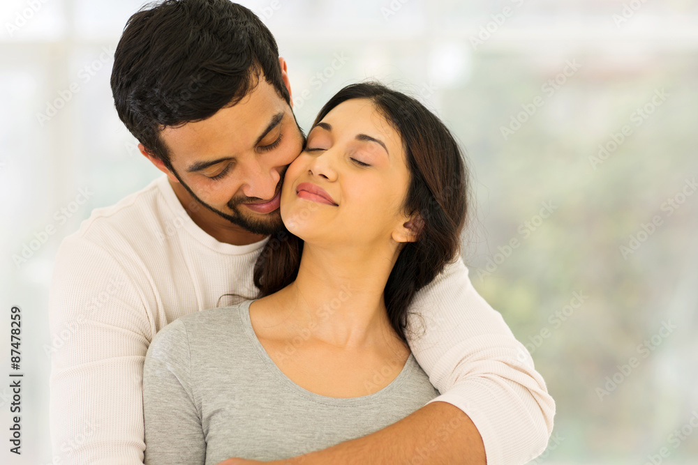 young indian couple embracing young indian couple embracing