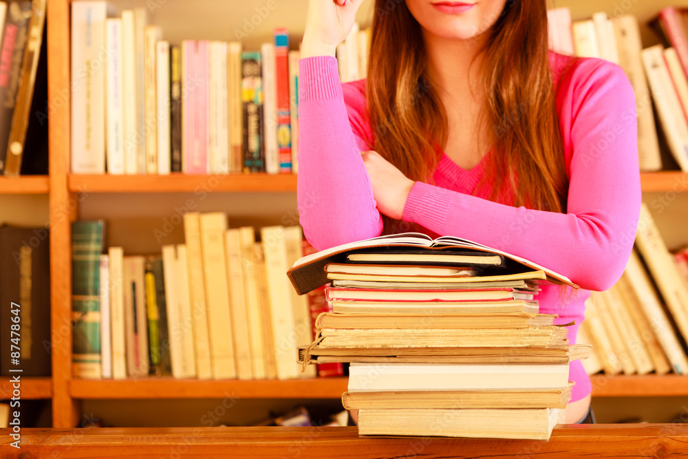 Girl student in college library Girl student in college library