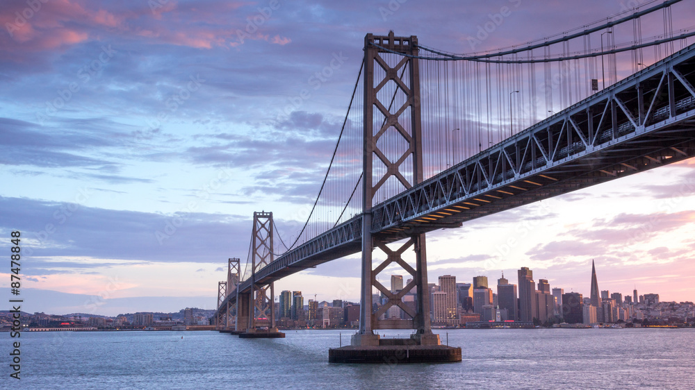 Sunset over San Francisco-Oakland Bay Bridge and San Francisco Skyline. Yerba Buena Island, San Francisco, California, USA. Sunset over San Francisco-Oakland Bay Bridge and San Francisco Skyline. Yerba Buena Island, San Francisco, California, USA.