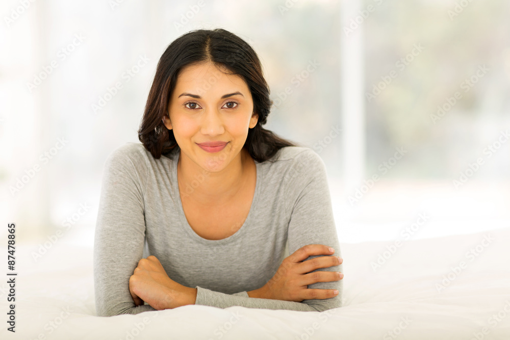 indian woman lying on bed