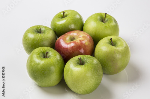 Some green apples on a white background