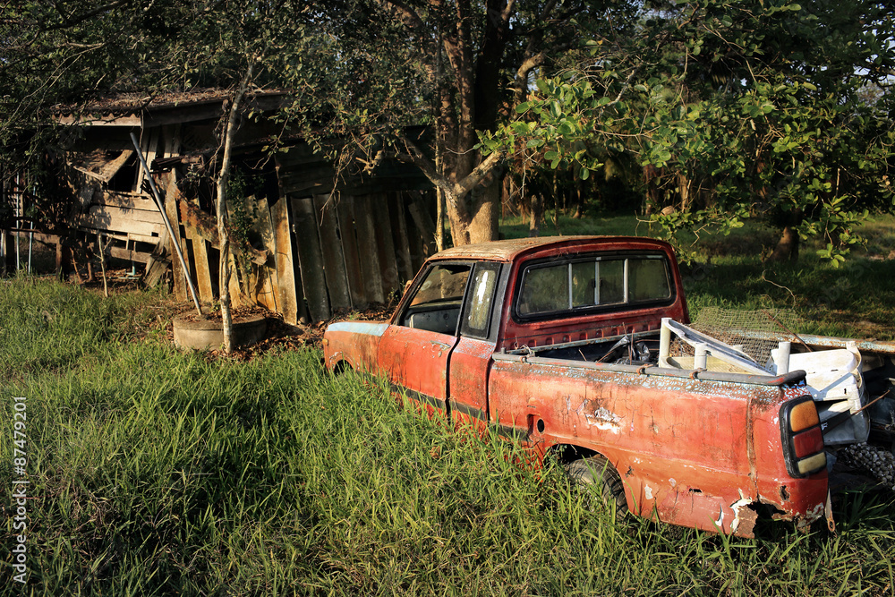 SURATTHANI, THAILAND - JUNE 4, 2014:Old Wrecked Car in farmland, SURATTHANI, THAILAND - JUNE 4, 2014:Old Wrecked Car in farmland,