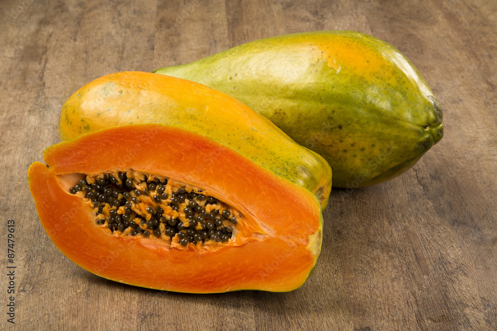 Fresh cut juicy tropical papaya mamao fruit with seeds at Brazil Fresh cut juicy tropical papaya mamao fruit with seeds at Brazil