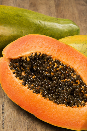 Fresh cut juicy tropical papaya mamao fruit with seeds at Brazil