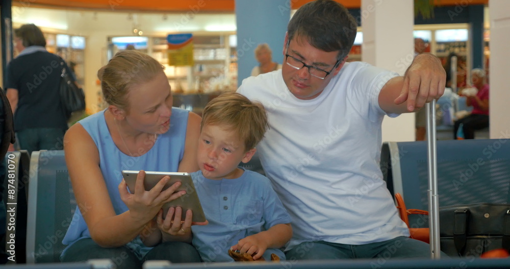 Family Waiting for Departure with Tablet PC Family Waiting for Departure with Tablet PC