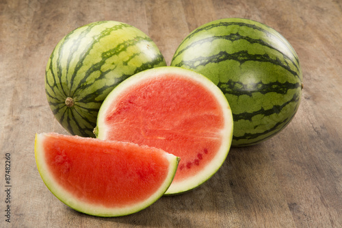 Canvas Print slices of watermelon on wooden table