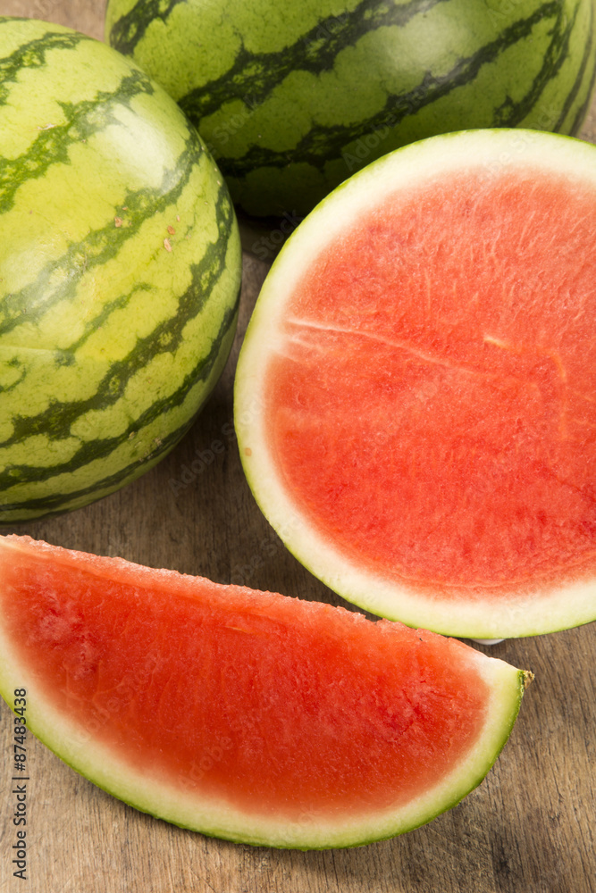 slices of watermelon on wooden table