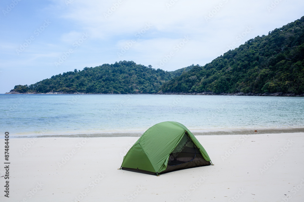beach camping, a green tent setup on the white sand quiet beach by the sea, Thailand