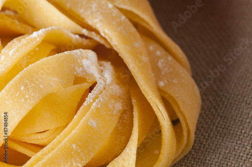 Fresh Pasta  close-up texture of Home made tagliatelle pasta flour ribbon noodle