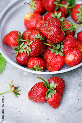 strawberries in an  metal bowl