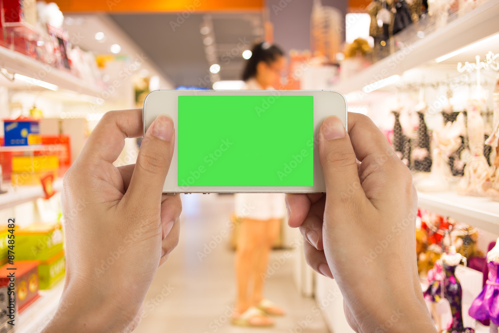 Photo blank. Women hand holding blank mobile smart phone in the Photo blank. Women hand holding blank mobile smart phone in the