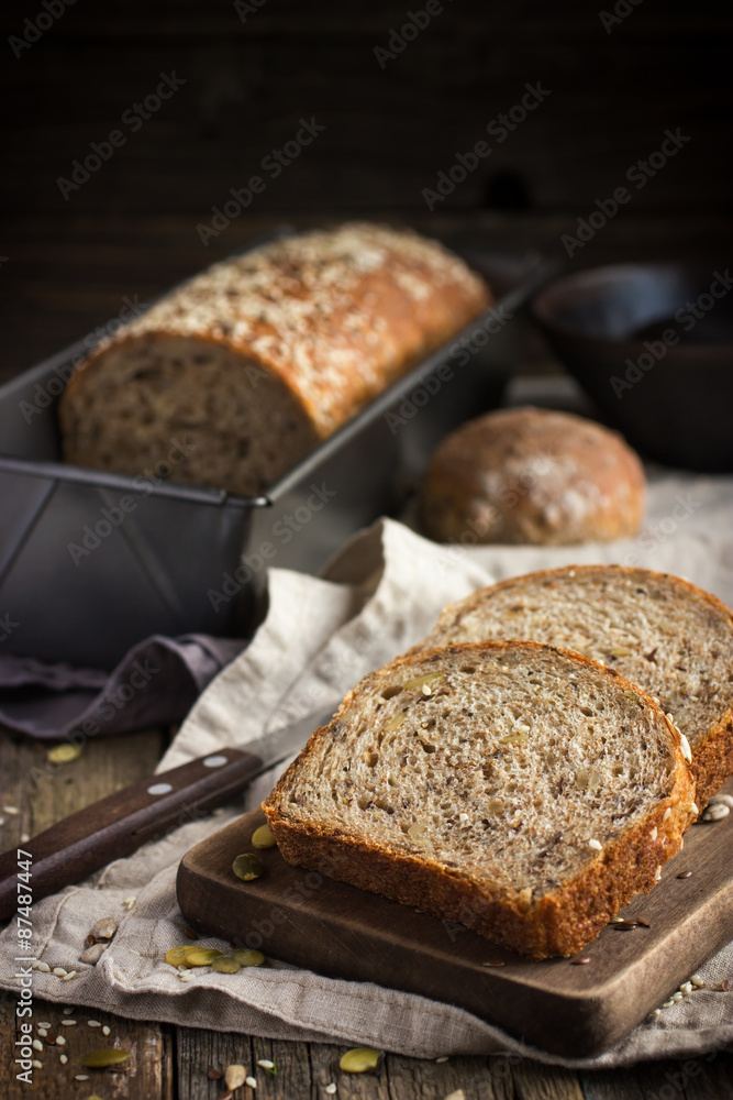 fresh multigrain bread on rustic background fresh multigrain bread on rustic background