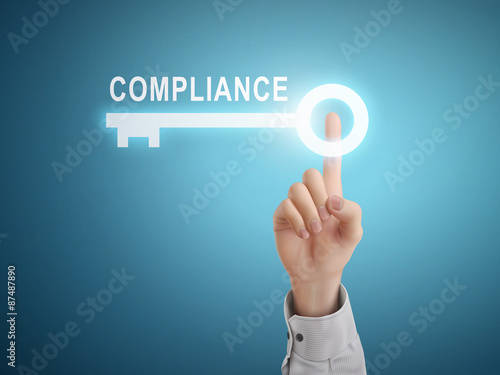 male hand pressing compliance key button