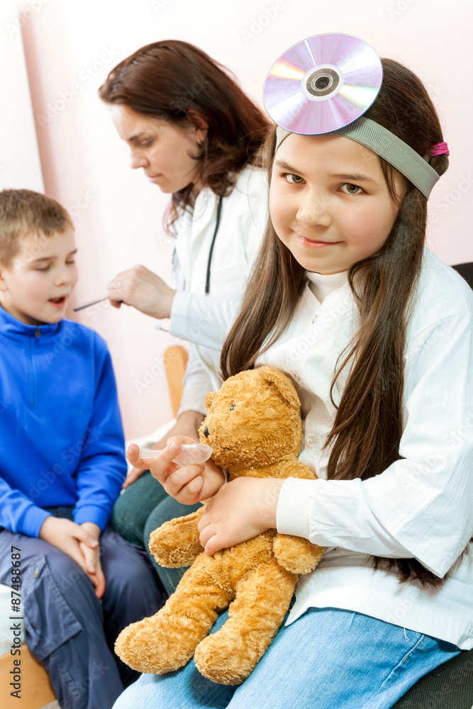 Doctor examining a child in a hospital Doctor examining a child in a hospital